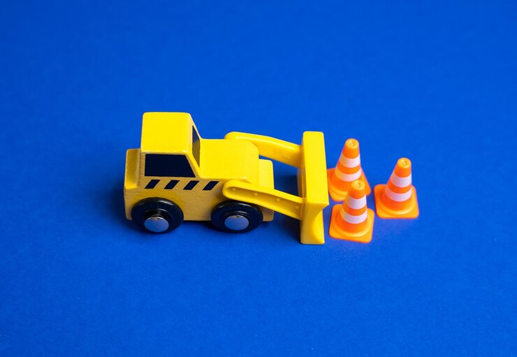 Foto um bulldozer amarelo move cones de tráfego o conceito de estabelecer ou remover restrições