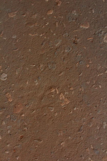 Foto um close-up de uma parede com pedras e cascalho