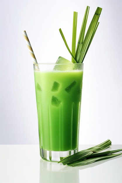 Um copo de smoothie verde com um canudo