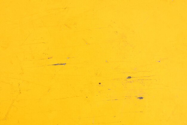 Um fundo amarelo com uma textura áspera