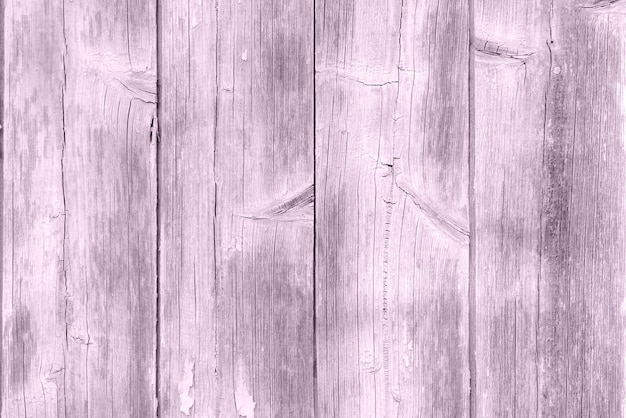 Um fundo de placa de madeira desgastado roxo pastel, textura