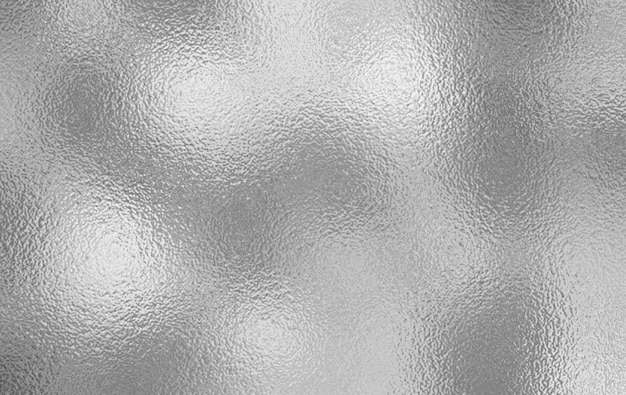 um fundo prateado com uma textura prateada que tem muita luz nele