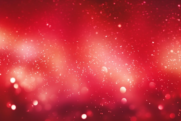 um fundo vermelho abstrato com luzes brilhantes e estrelas brilhantes
