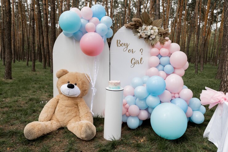 Foto um grande urso de brinquedo em uma celebração perto da zona de fotos para uma festa de aniversário de gênero