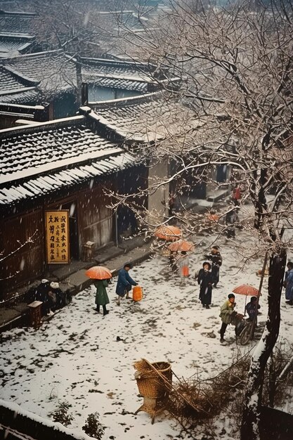 Foto um grupo de pessoas está andando na neve com guarda-chuvas