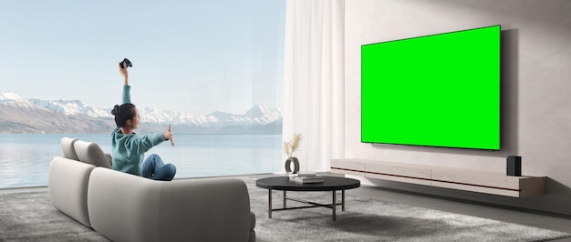 Um homem e uma mulher estão sentados em um sofá em uma sala de estar, assistindo TV com tela verde.