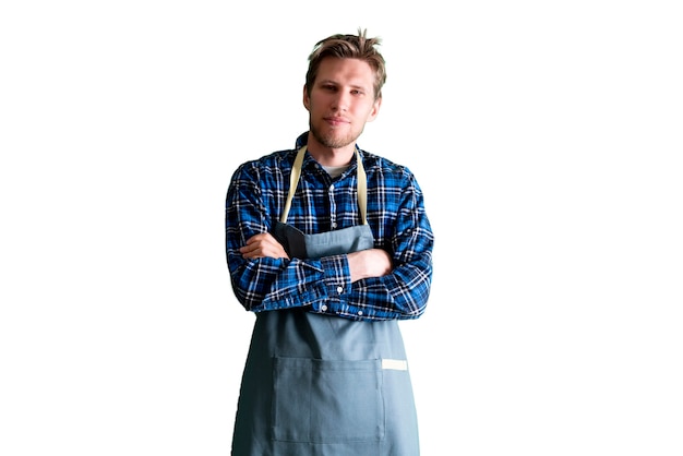 Um jovem chef de cozinha masculino colocado com um retrato de avental, fundo branco isolado