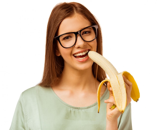 Um, menina jovem, segurando, um, banana, isolado