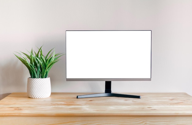 Um monitor de computador preto em uma mesa de madeira Mock up para design teplate interior minimalista elegante