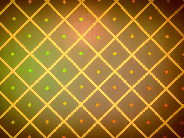 Foto um padrão colorido com quadrados e quadrados em laranja e verde.