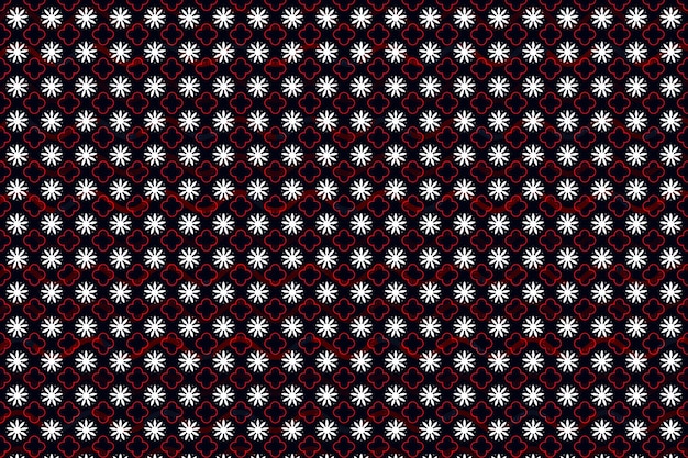 Um padrão preto e vermelho com flores brancas.