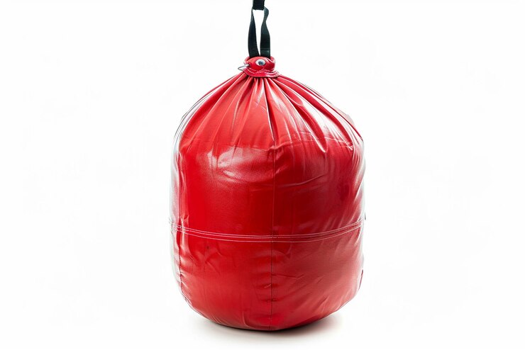 Foto um saco vermelho com uma maçaneta preta que diz uma citação