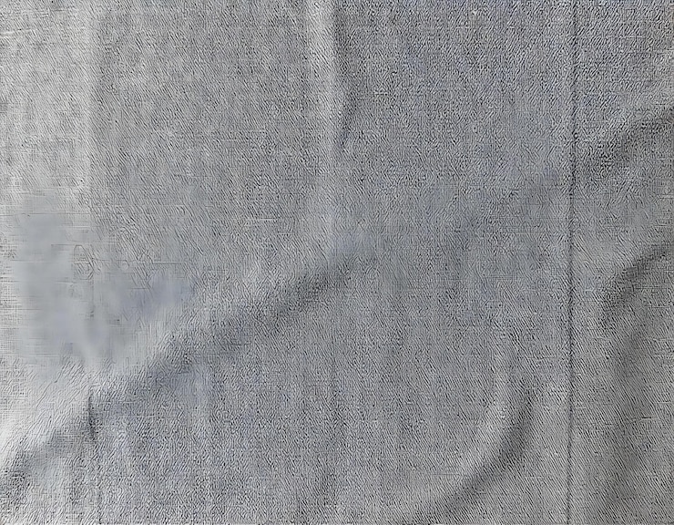 Foto um tecido cinza com um fundo branco que diz o número 3