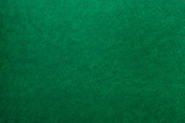 Foto um velho papel verde texturizado fundo