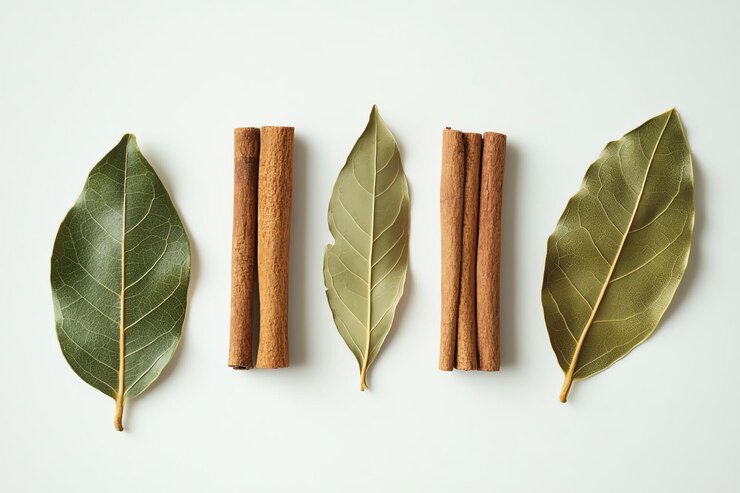 Foto uma camada plana de varas de canela, folhas de louro e cravos arranjados lindamente mostrando especiarias aromáticas