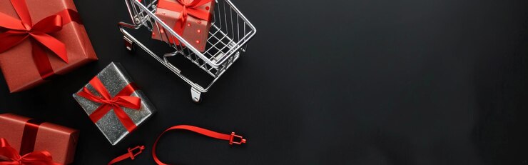 Foto uma cesta de presentes de natal com uma fita vermelha