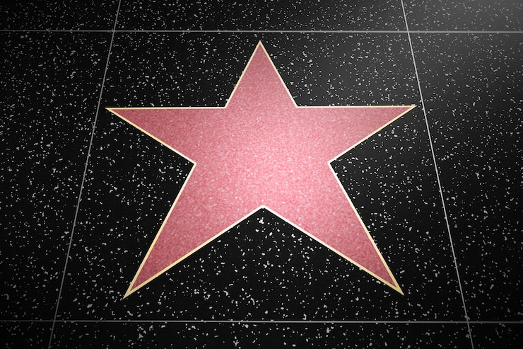 Foto uma estrela rosa na calçada da fama.
