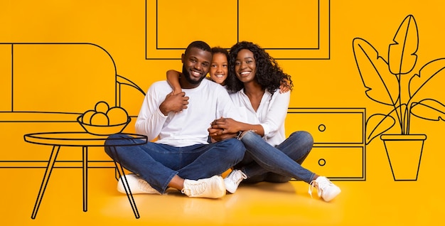 Uma jovem e alegre família negra abraçada com a filha aprecia o design da nova casa no interior da sala de estar