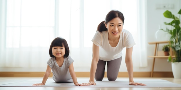 Uma jovem mãe e sua filha fazem alongamento de ioga fitness juntas em casa