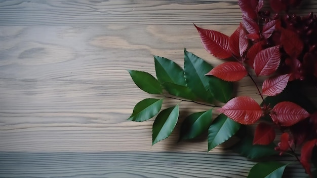Uma mesa de madeira com folhas vermelhas e uma flor vermelha