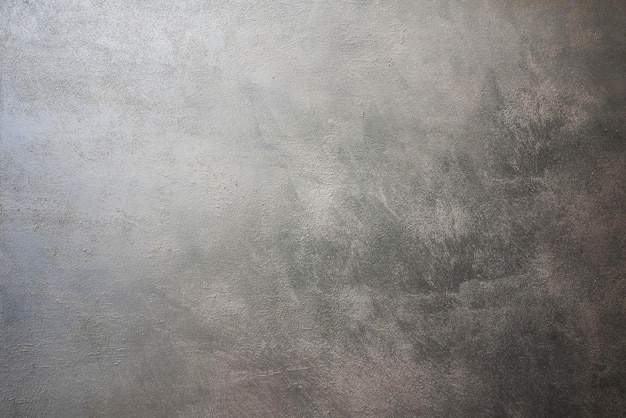 Uma parede cinza com um fundo texturizado cinza escuro