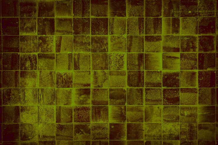 Foto uma parede com um fundo verde com um padrão de azulejos verdes e amarelos