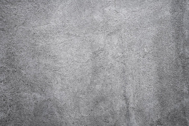 Uma parede de concreto cinza com um fundo de superfície texturizada áspera