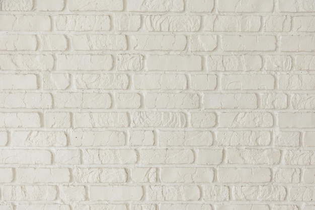 Uma parede de tijolos brancos com a palavra tijolo nela.