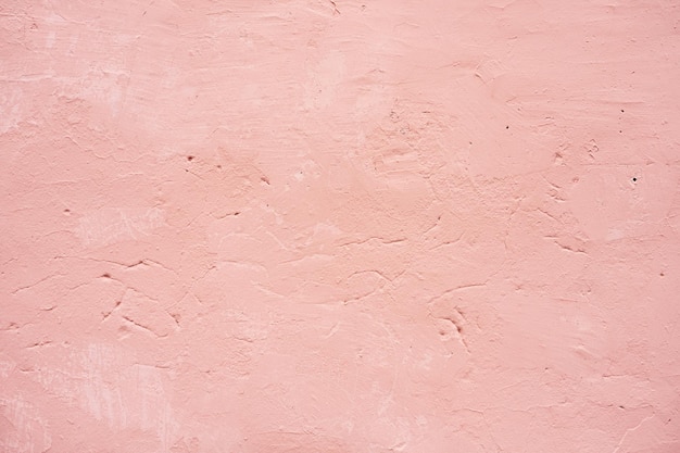 Foto uma parede rosa com uma superfície texturizada áspera e uma superfície texturizada áspera branca.