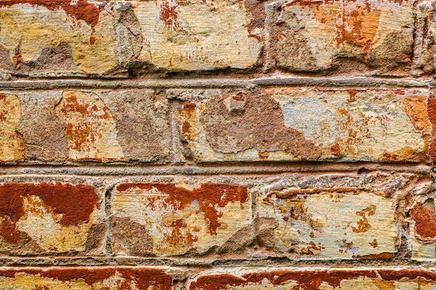 Foto uma parte da velha parede de tijolo vermelho