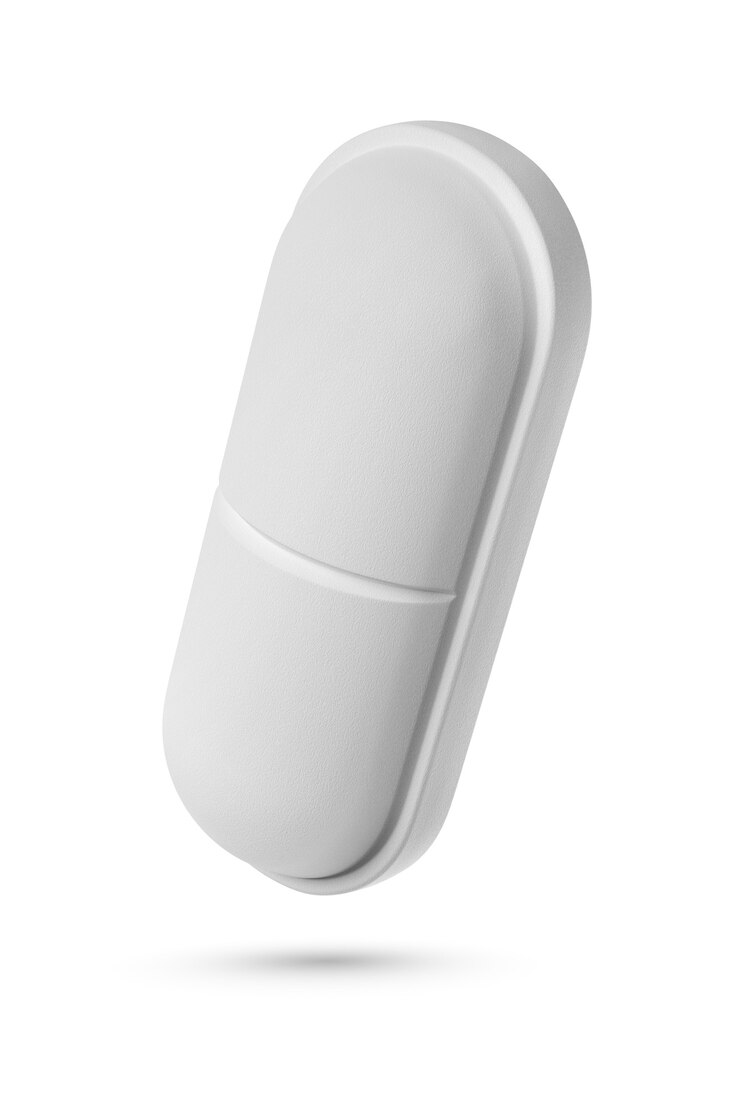 Foto uma pílula médica de forma oblonga isolada na superfície branca. renderização 3d