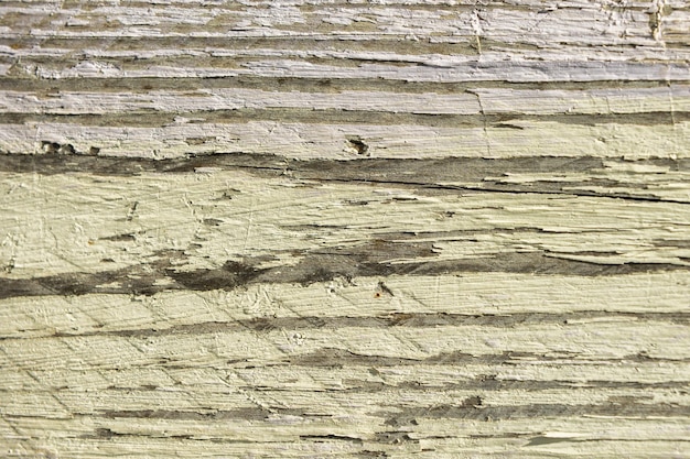 Foto uma prancha de madeira com pintura bicolor descascada