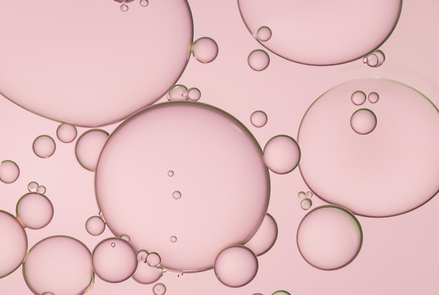 Foto uma saboneteira rosa com bolhas no meio.