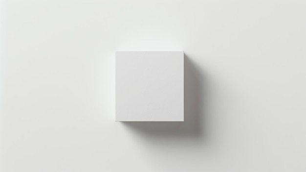 Uma simples caixa branca senta-se em uma superfície branca A caixa é simples e sem adornos sem marcas ou características visíveis