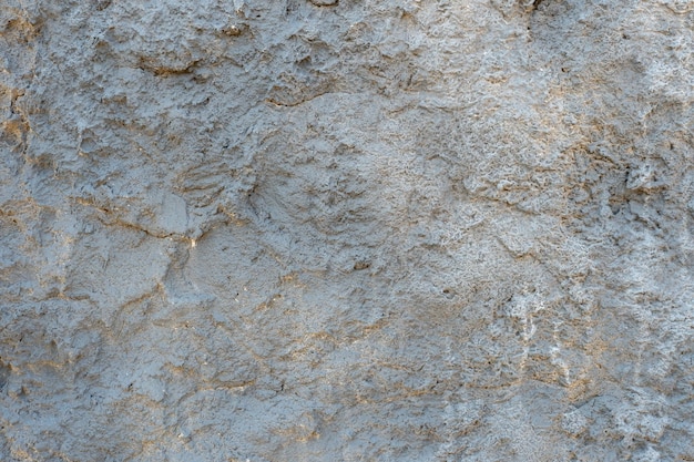 Uma superfície de concreto vazia com rachaduras e vestígios de tinta velha O fundo é uma parede velha pintada Um lugar para inserir texto ou desenho