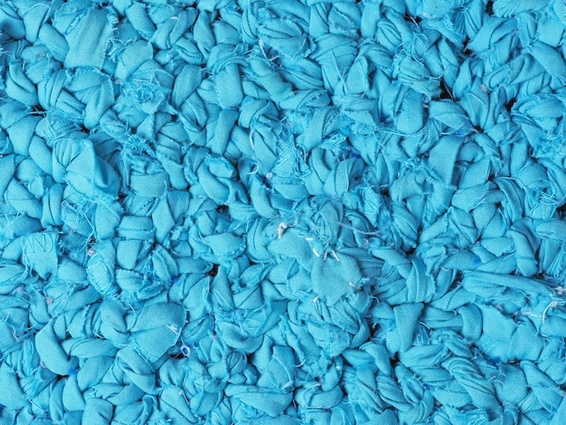 Uma visão de cima do tapete azul tecido. Pode ser usado como uma textura perfeita