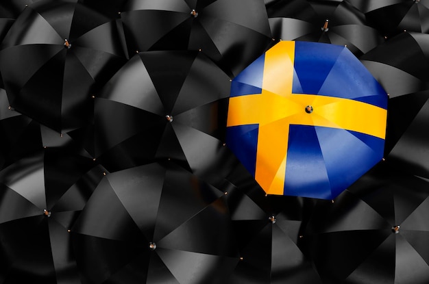 Umbrela com bandeira sueca entre guarda-chuvas pretas renderização 3D