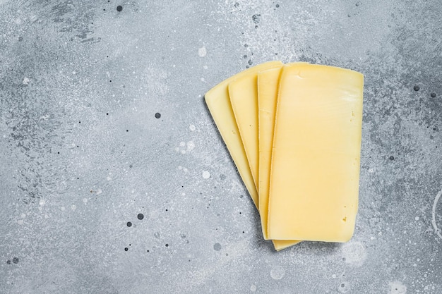 Ungekochte Raclette Schweizer Käsescheiben Grauer Hintergrund Ansicht von oben Kopieren Sie Platz