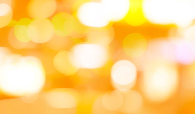 Unscharfer gelber und goldener Bokeh-Hintergrund Verwischen Sie den abstrakten Hintergrund des gelben Lichts Gelbes Licht