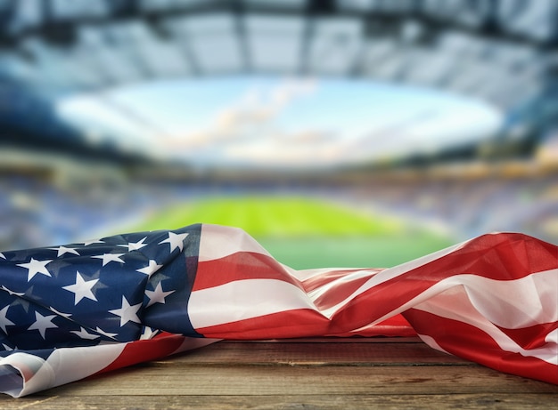 USA-Flagge mit Stadion im Hintergrund