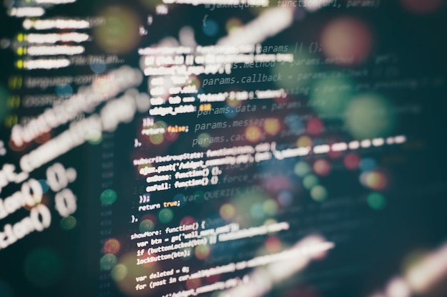 Uso de CSS, JavaScript y HTML. Supervisar el primer plano del código fuente de la función. Fondo abstracto de tecnología de TI. Código fuente del software.