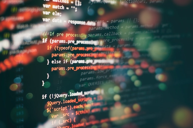 Uso de CSS, JavaScript y HTML. Supervisar el primer plano del código fuente de la función. Fondo abstracto de tecnología de TI. Código fuente del software.