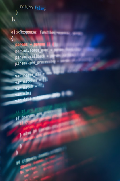 Uso de CSS, JavaScript y HTML. Supervisar el primer plano del código fuente de la función. Fondo abstracto de tecnología de TI. Código fuente del software.