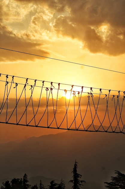 Foto valla de silueta contra el cielo durante la puesta de sol