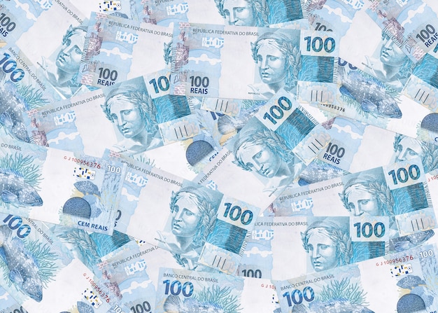 Várias notas de cem reais do brasil, textura de dinheiro brasileiro, notas de superfície de reais