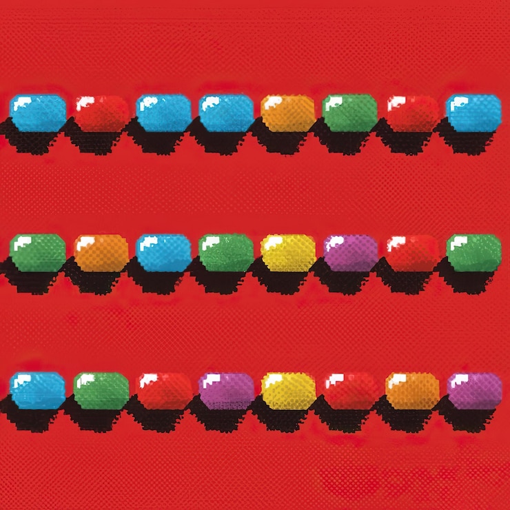 Foto una variedad de pastillas dispuestas cuidadosamente sobre un telón de fondo rojo vibrante ai generado