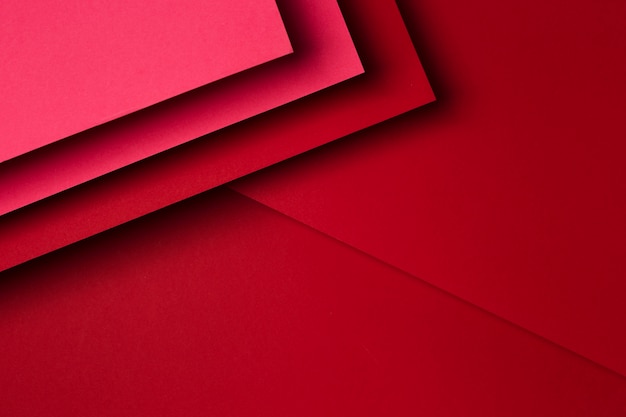 Foto variedade plana leiga de fundo de folhas de papel vermelho