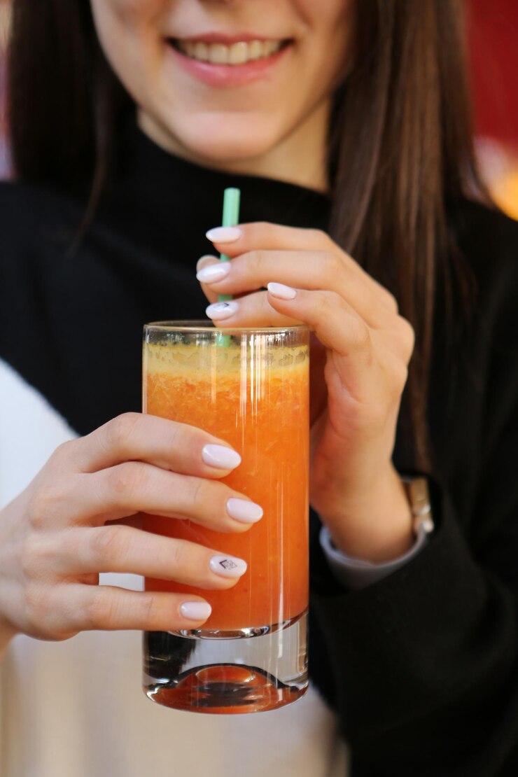 Un vaso de jugo de naranja sabroso