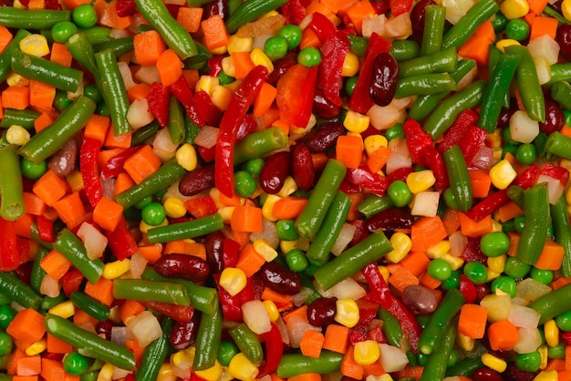 Verduras en rodajas maíz frijoles guisantes zanahorias pimientos fondo