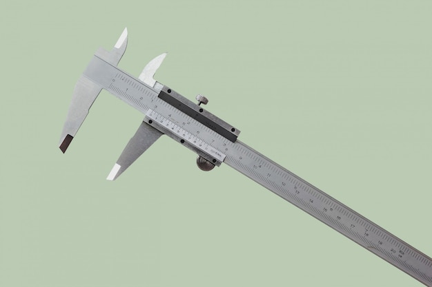 Vernier es una medida de los trabajos y la industria se mide en centímetros y pulgadas aisladas sobre fondo de color pastel.